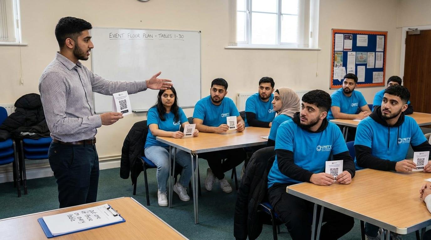 Event organiser briefing volunteers with QR code cards before a fundraising dinner